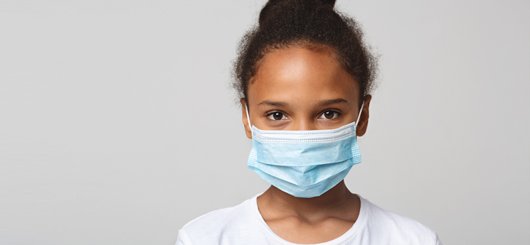 young girl wearming mask