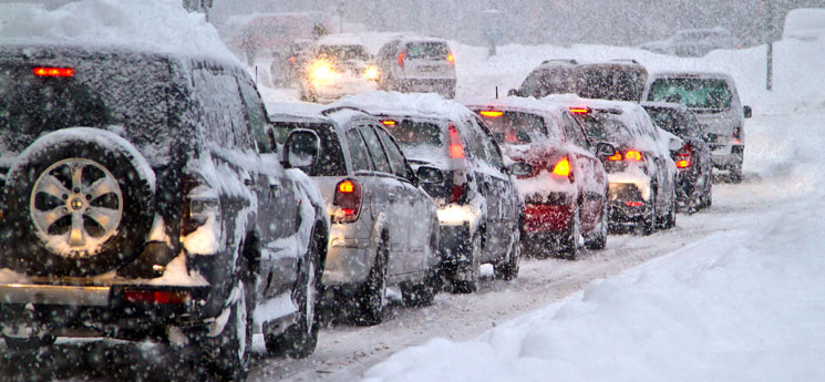 cars driving through snow